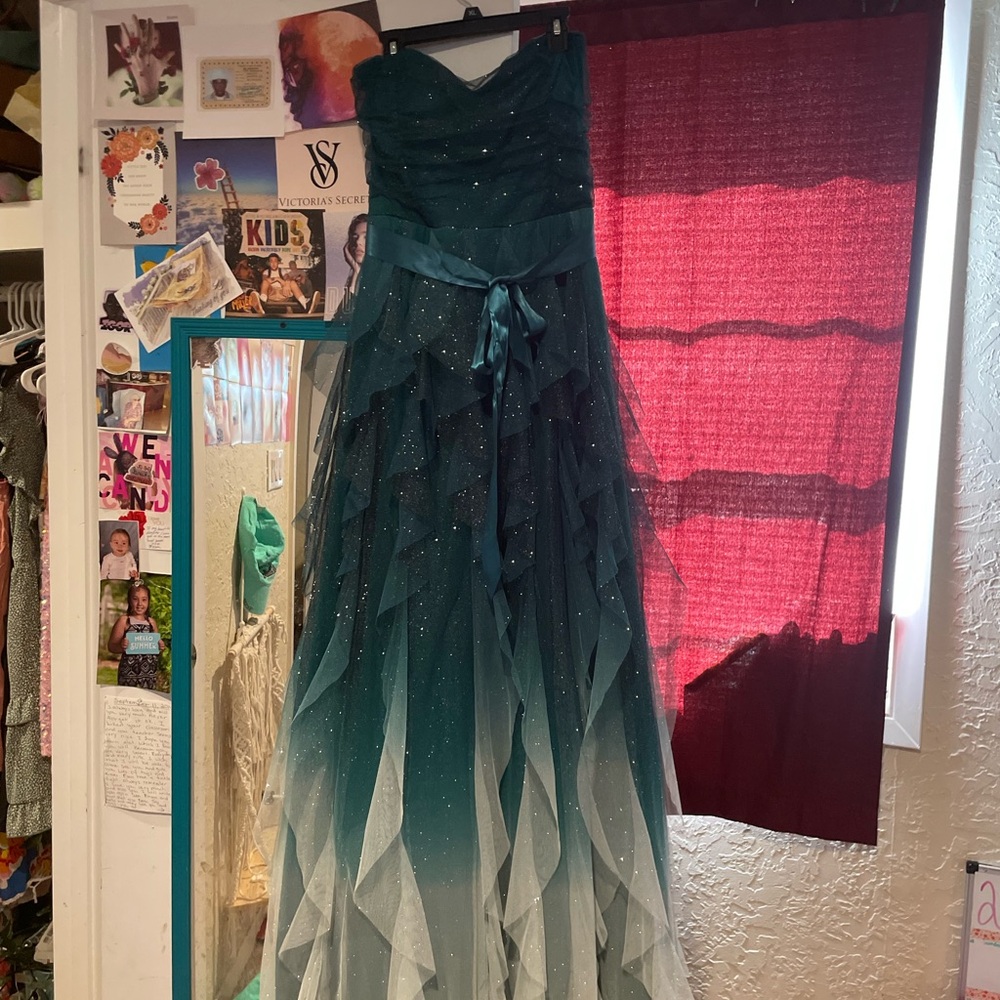 Dillards prom dress. Emerald green ombré towards bottom. Glittery and flowy.